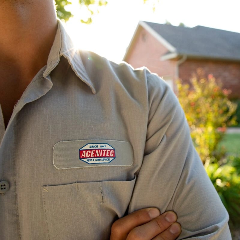The Acenitec “Since 1947” patch on a technician's uniform